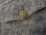 a close up of a jacket with a button on it