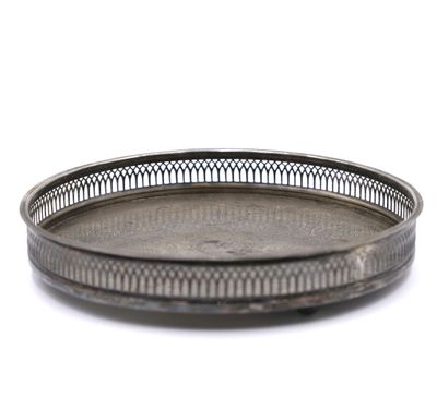 silver plate on a white background with a pattern on the rim