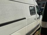 a white van that is parked in a lot