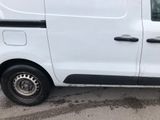 a white van that is parked in a parking lot