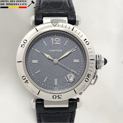 an image of a close up of a wrist watch on a white surface