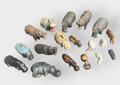 a lot of small figurines of animals on a white surface