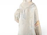 a figurine of a woman in a white dress