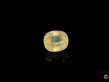 an image of a yellow moon in the dark sky with a reflection on the ground