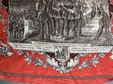 an old picture of a group of men standing in front of a banner