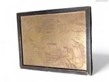 a picture of a gold picture in a black frame
