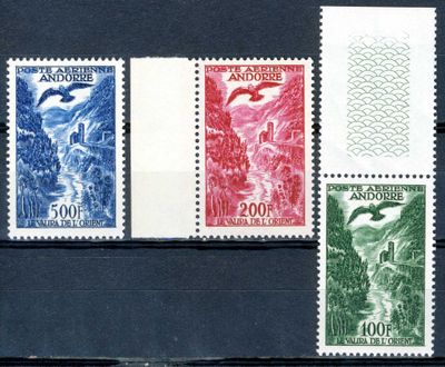 four different colored stamps on a black surface with a picture of a mountain