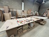 a workbench in a building with many tools on it
