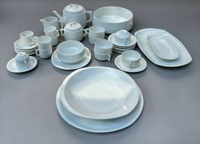 a picture of a table with a lot of white plates and bowls