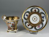 pair of porcelain cups and saucers with gold rims