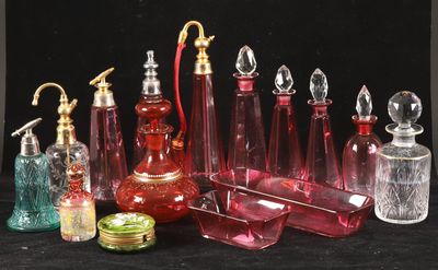 a lot of different colored glass bottles on a black surface