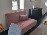 a living room with a couch and a chair in it
