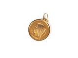 une image représentant une pièce d'or sur laquelle figure une feuille