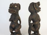 pair of carved wooden figures of a monkey and a dog