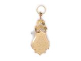 an image of a gold plated keychain with a small bird on it