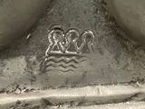 a close up of a metal object with a design on it