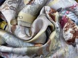 a close up of a piece of clothing with a scarf