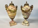 pair of antique marble urns with gilded handles on marble bases