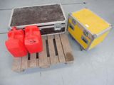 two red containers and a yellow box on a pallet