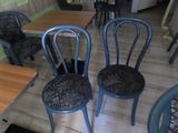 four chairs that are sitting on a wooden floor