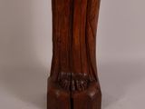 an image of a wooden statue of a woman holding a baby