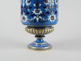 an image of a blue and gold vase on a white background