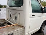 a white truck with a flat bed parked on the side of the road