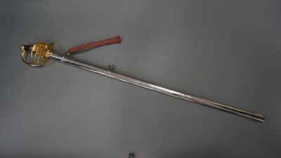 a sword that is on display on a table