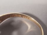 an image of a close up of a ring with a diamond on it