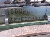 a close up of a sign on the back of a jeep