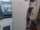 an image of a kitchen with a refrigerator in it