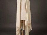 a white shawl draped over a mannequin mannequin mannequin mannequin mannequin mannequin mannequin mannequin mann