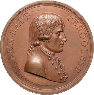 an image of a bronze medal of a man with a beard
