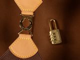 a brown bag with a lock and a padlock on it