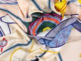 a close up of a scarf with a map on it