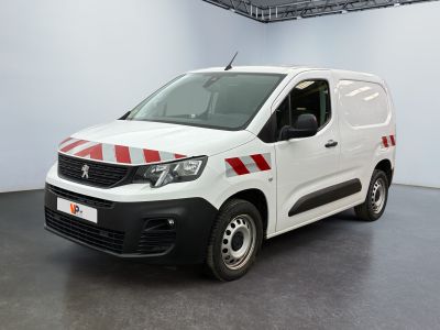the white van is parked in a large room with a red and white stripe on the side