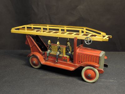 a toy fire truck with a ladder on top of it