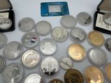 a lot of coins and a card on the table