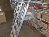 a ladder that is leaning against a wall in a warehouse
