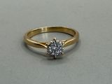 an image of a diamond ring on a table with a white background