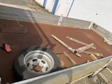 a truck that has a tire on the back of it