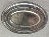 a silver plate that is sitting on a table