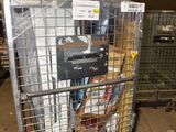 a metal cart with many items in it in a warehouse