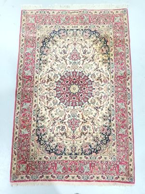 an antique persian rug with a floral design on a white background