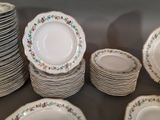 a lot of plates that are sitting on a table