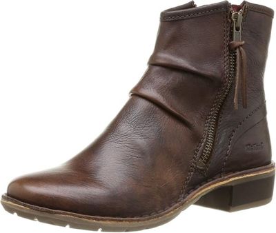 un gros plan sur une botte marron dotée d'une fermeture éclair sur le côté