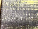 a black and yellow painting on the wall of a room