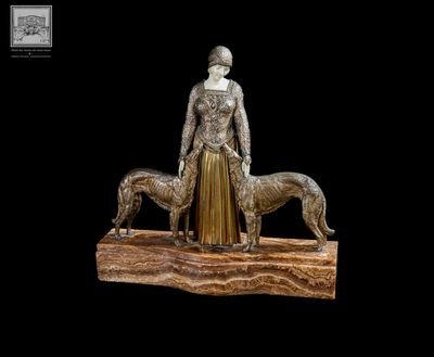 une image représentant une statue d'une femme et de deux chiens