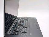 a laptop computer that is open on a white surface