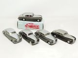 several toy cars are lined up in a row in front of a box
